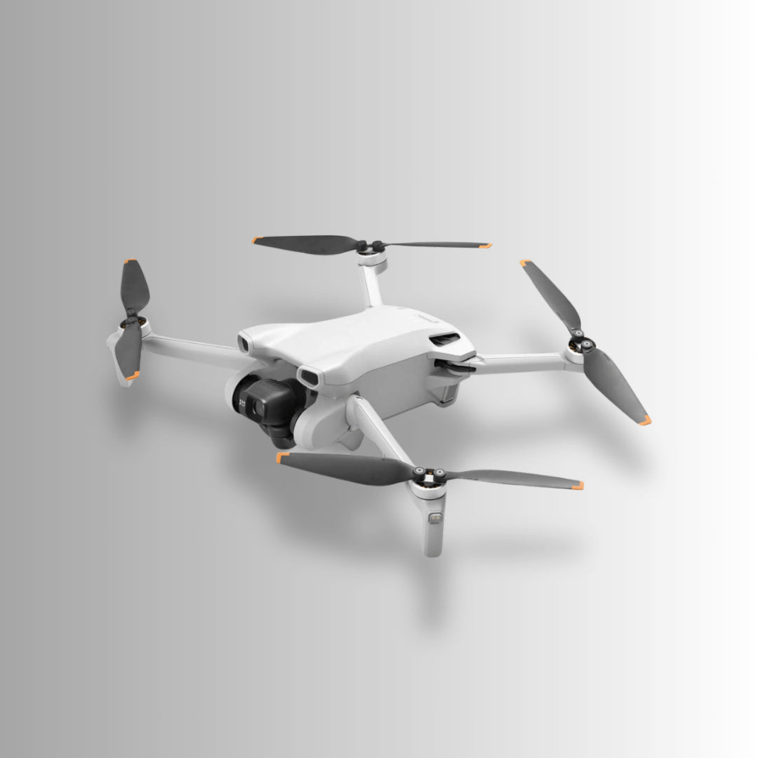 DJI Mini 3 drone with four propellers, designed for lightweight aerial photography and adventure.