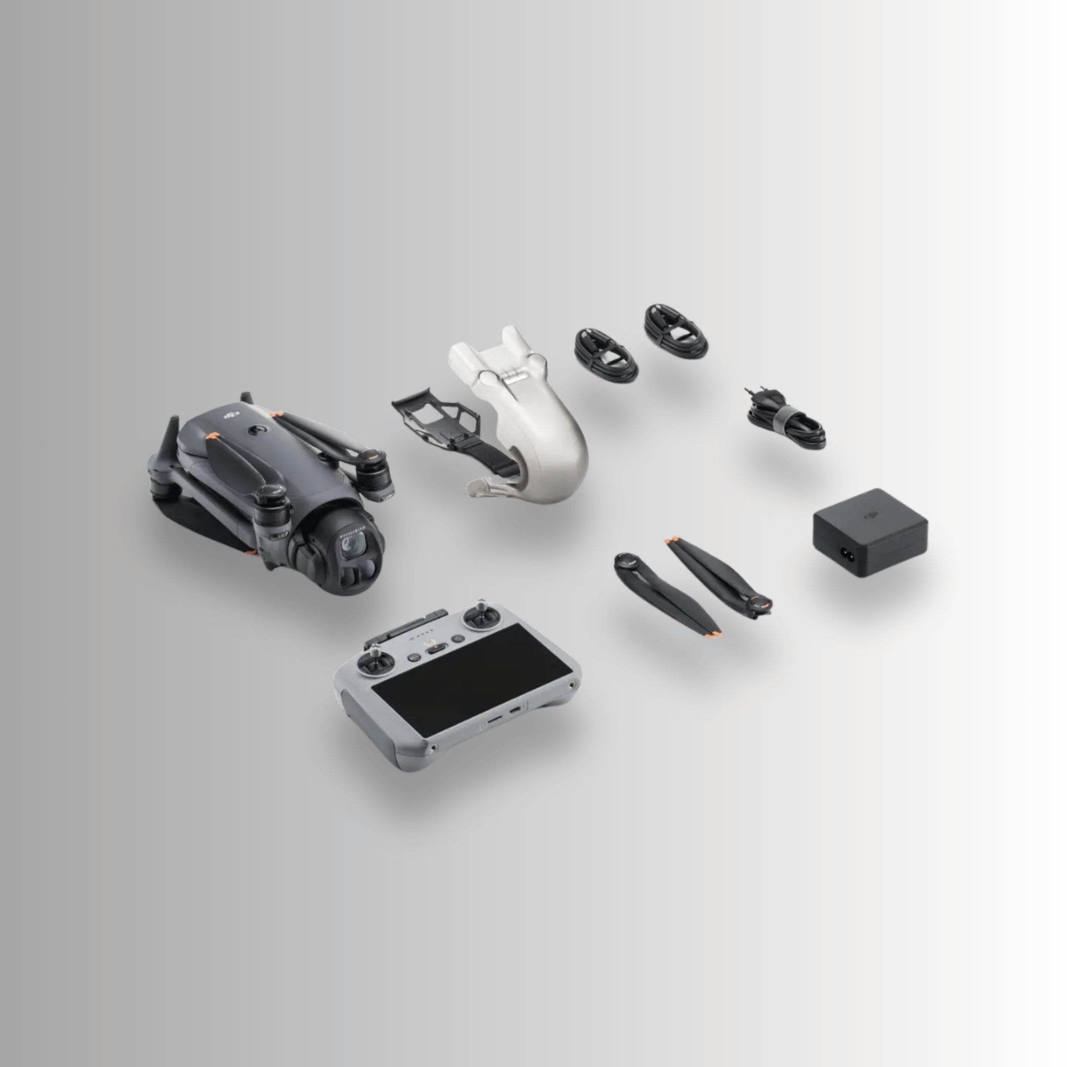 Disassembled dji mavic 4 pro drone and dji rc 2 remote controller beside box contents on a light gray background