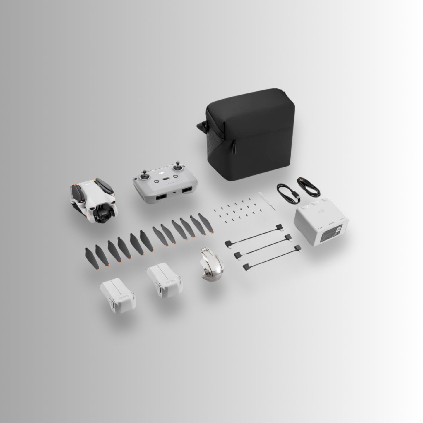 DJI Mini 3 Fly More Combo contents including drone, controller, propellers, battery, and charging accessories.