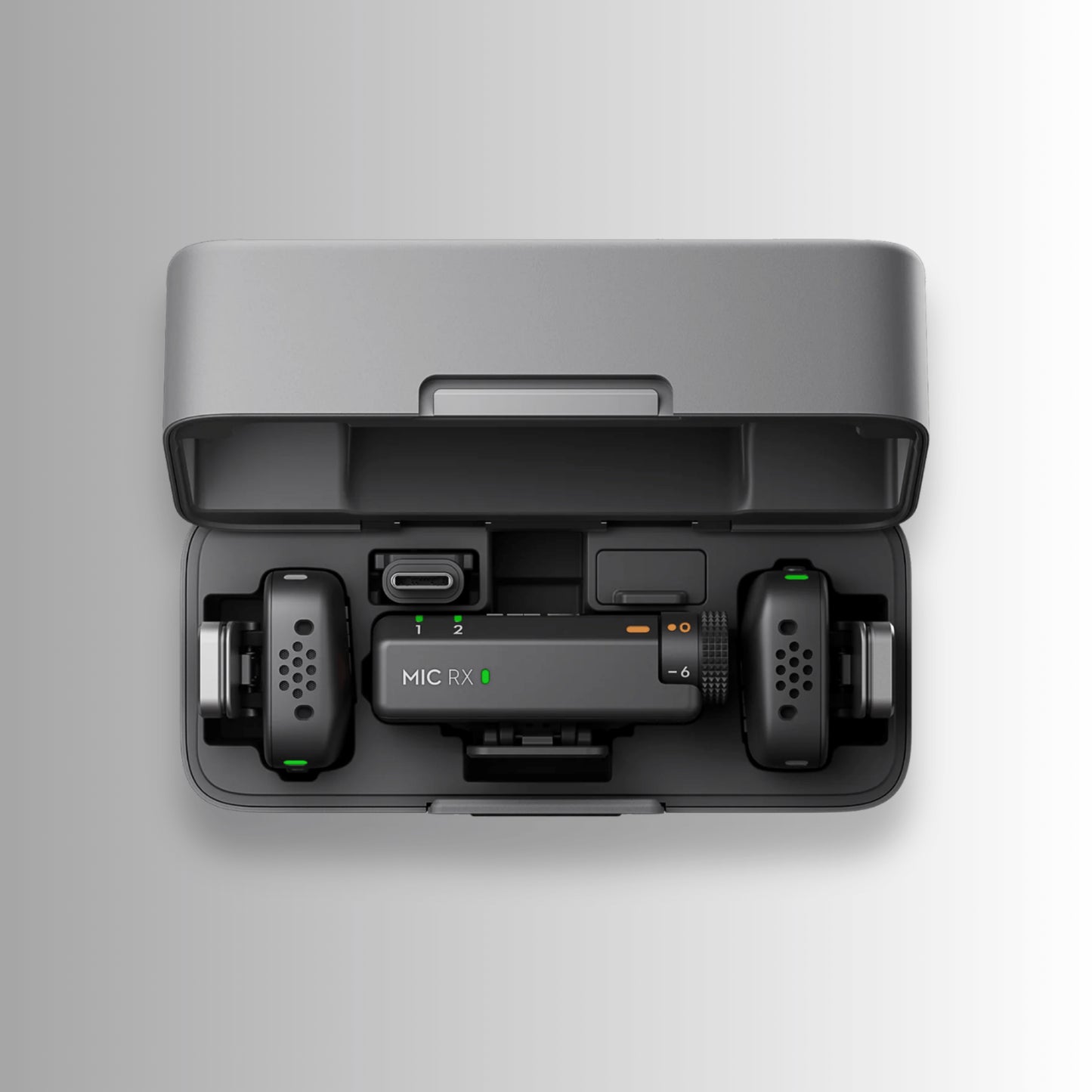 Top view of DJI Mic Mini 2 TX + 1 RX system in charging case with LED battery indicators