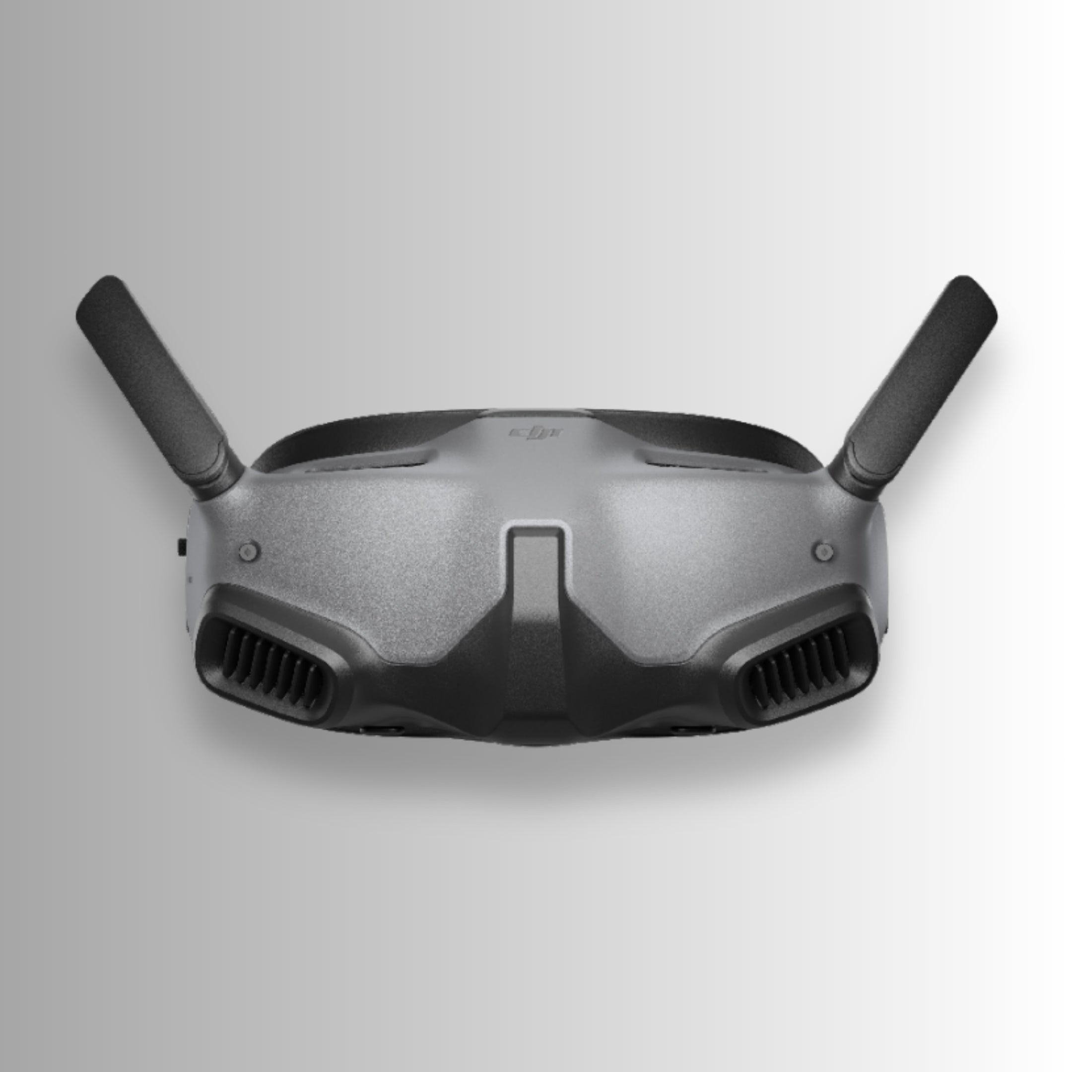 Black dji goggles integra with DJI logo on a gray background