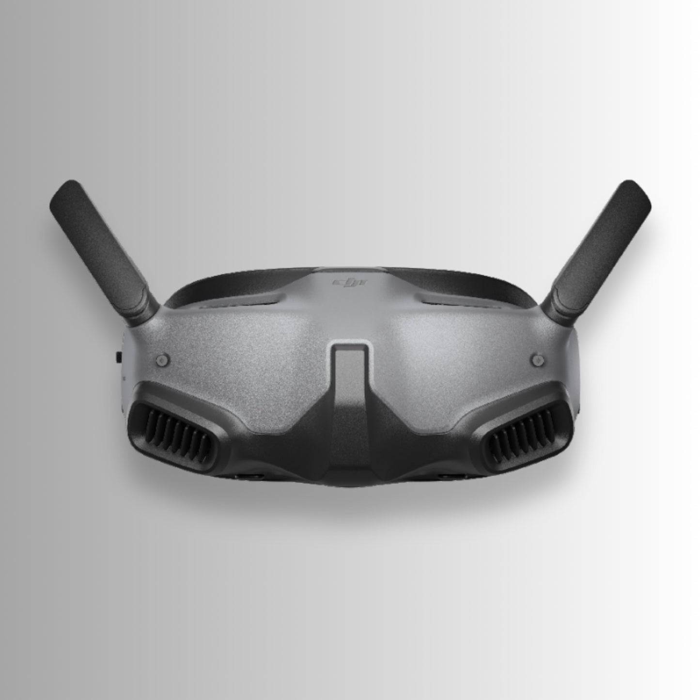 Black dji goggles integra with DJI logo on a gray background