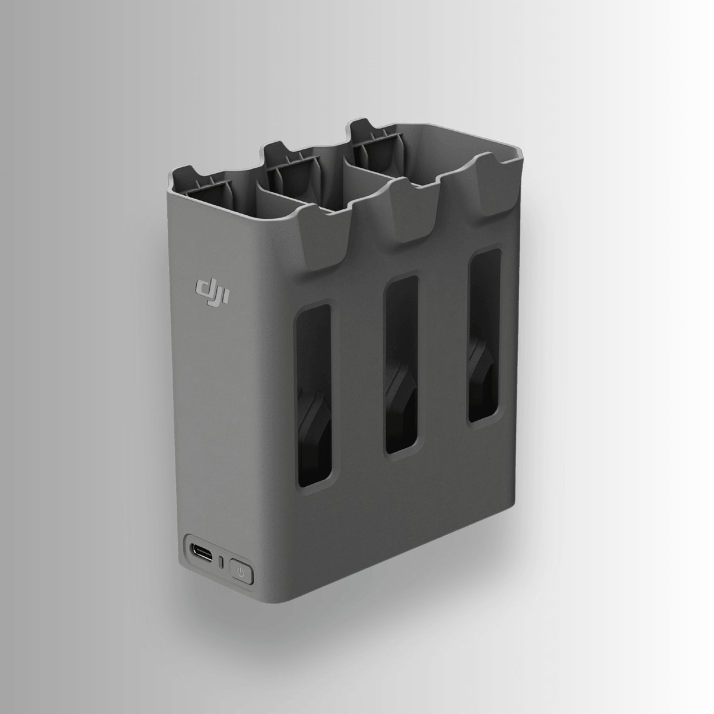 Grey two-way charging hub with multiple slots and a USB port for DJI Avata 360 on a white background