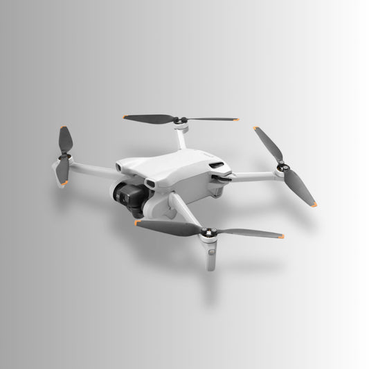 DJI Mini 3 drone with four propellers, designed for lightweight aerial photography and adventure.