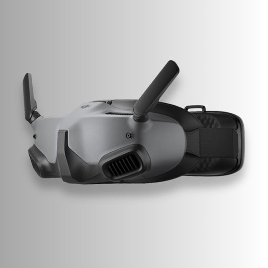Black dji goggles integra with DJI logo on a gray background