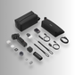 An DJI OSMO Pocket 4P vlog combo camera accessory kit arranged on a light grey studio background, including two black zip pouches, a camera grip, battery, charger cables, strap, microphone and small accessories.