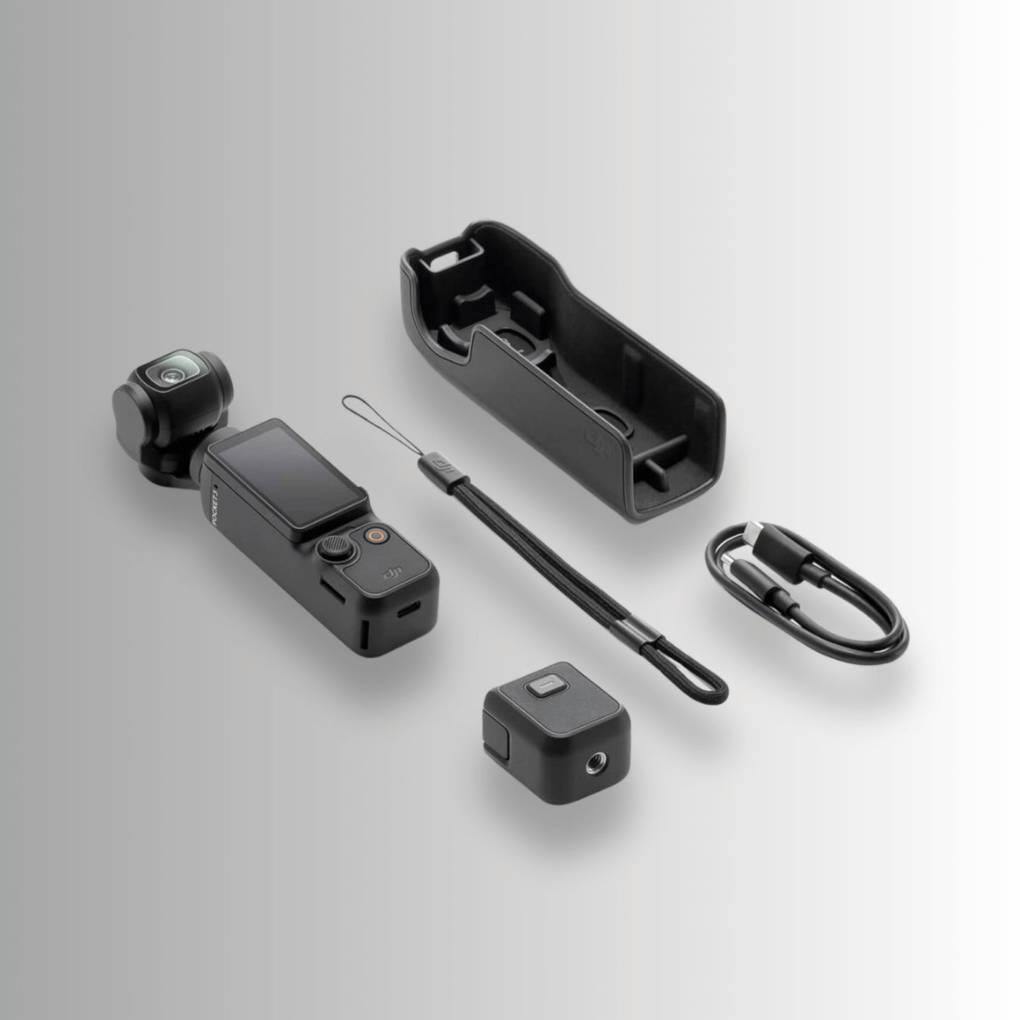 DJI Osmo Pocket 3 unboxed contents including camera, protective cover, wrist strap and USB-C cable