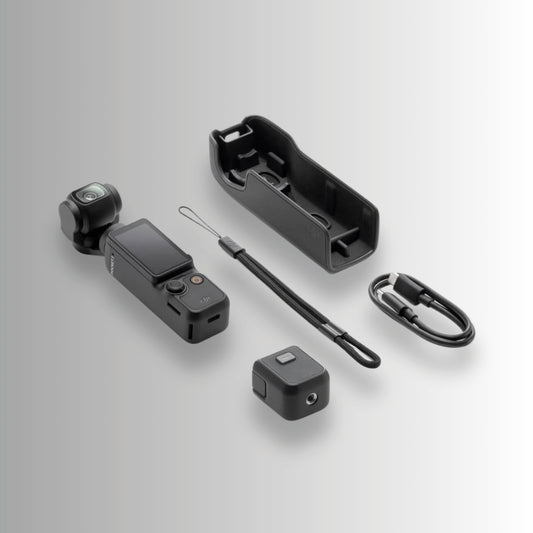 DJI Osmo Pocket 3 unboxed contents including camera, protective cover, wrist strap and USB-C cable