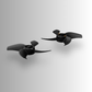 Two angled black DJI Avata 360 drone propellers on a light gray background
