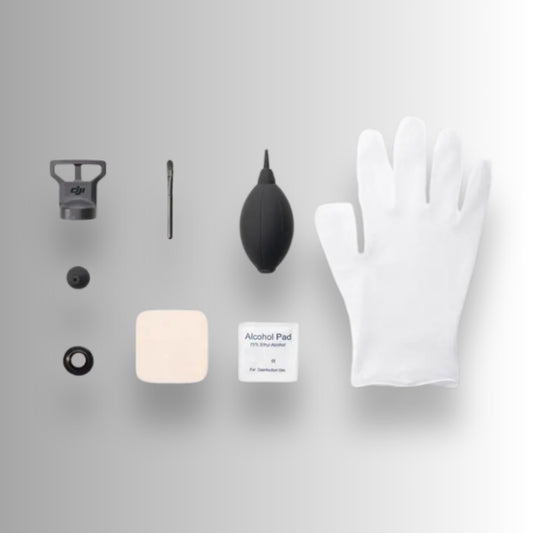 Collection of DJI Avata 360 camera cleaning tools including a black brush, white cloth, and small containers on a grey background