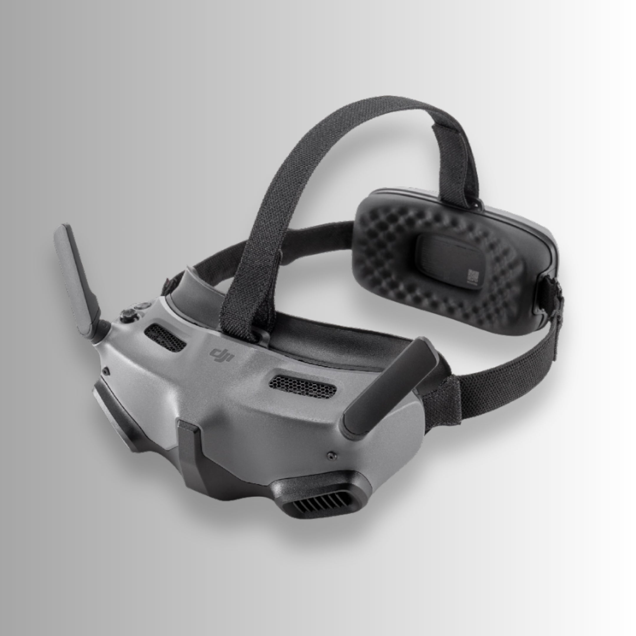 Black dji goggles integra with DJI logo on a gray background