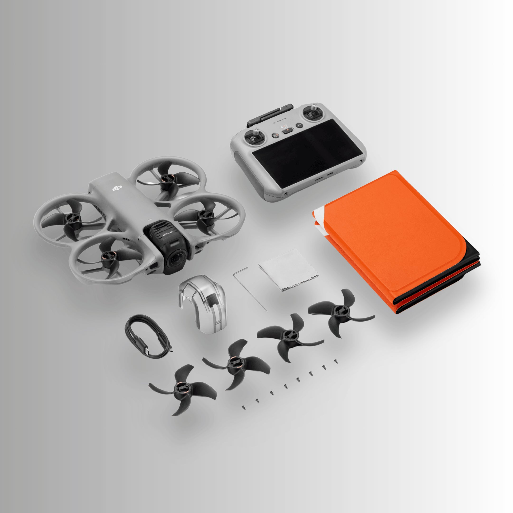 DJI Avata 360 Drone components including the drone, controller and box contents on a light gray background