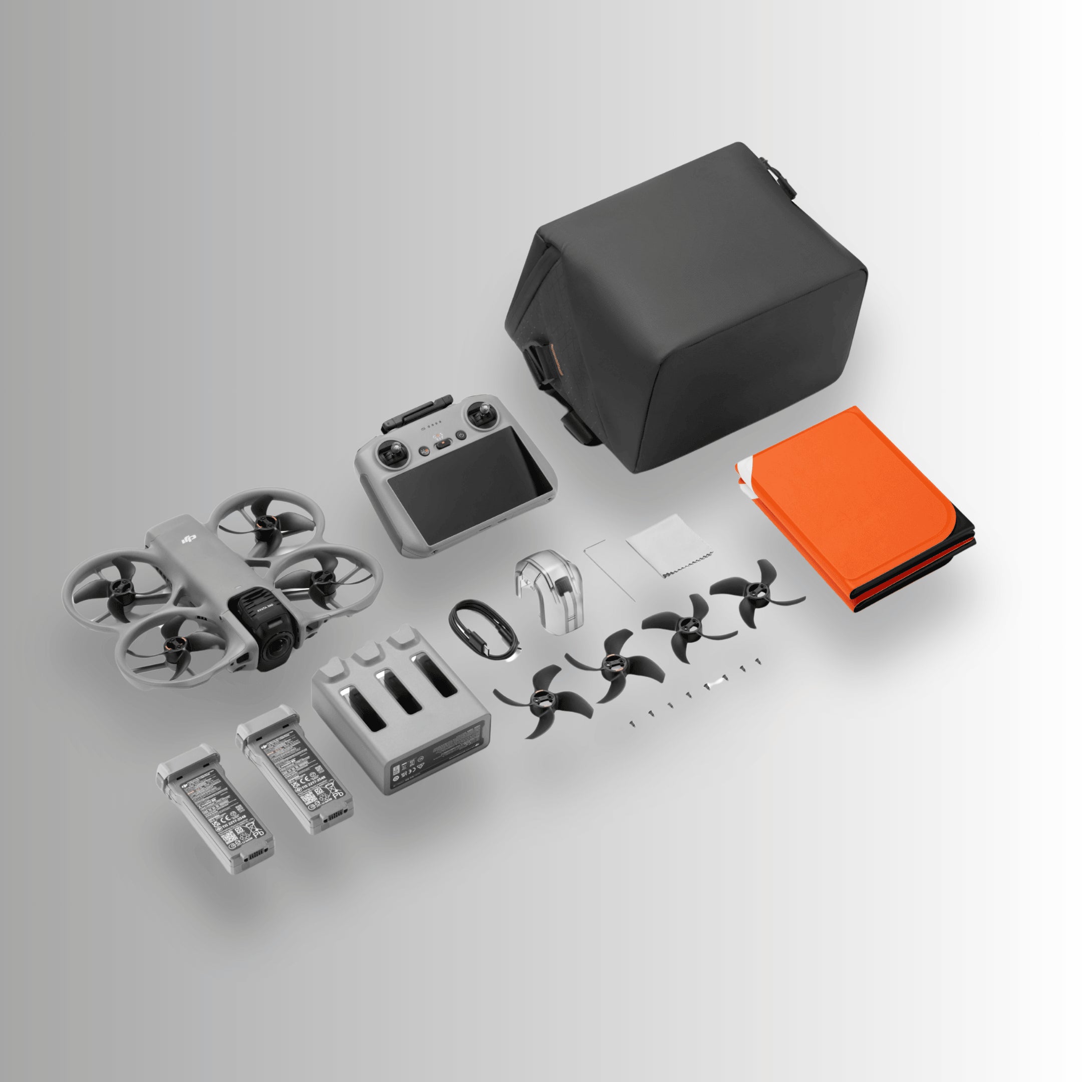 DJI Avata 360 fly more combo drone parts and accessories on a light gray background