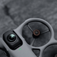 Close-up of a DJI Avata 360 drone's camera and propellers with a blurred background