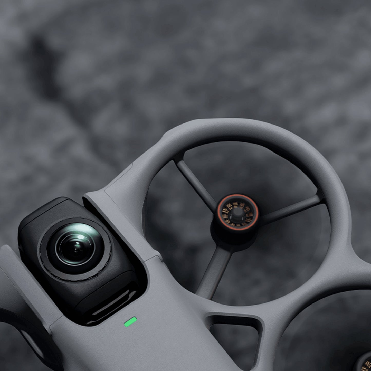 Close-up of a DJI Avata 360 drone's camera and propellers with a blurred background