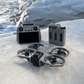 DJI Avata 360 fly more combo drone and RC 2 controller on a snowy surface