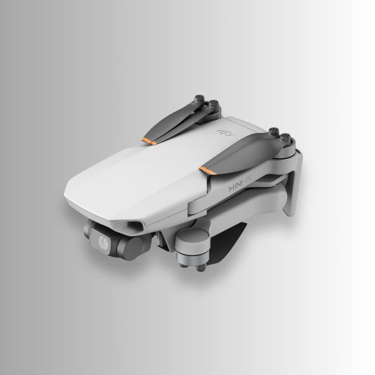 Compact DJI Mini 4K Fly More Combo drone folded and ready to travel