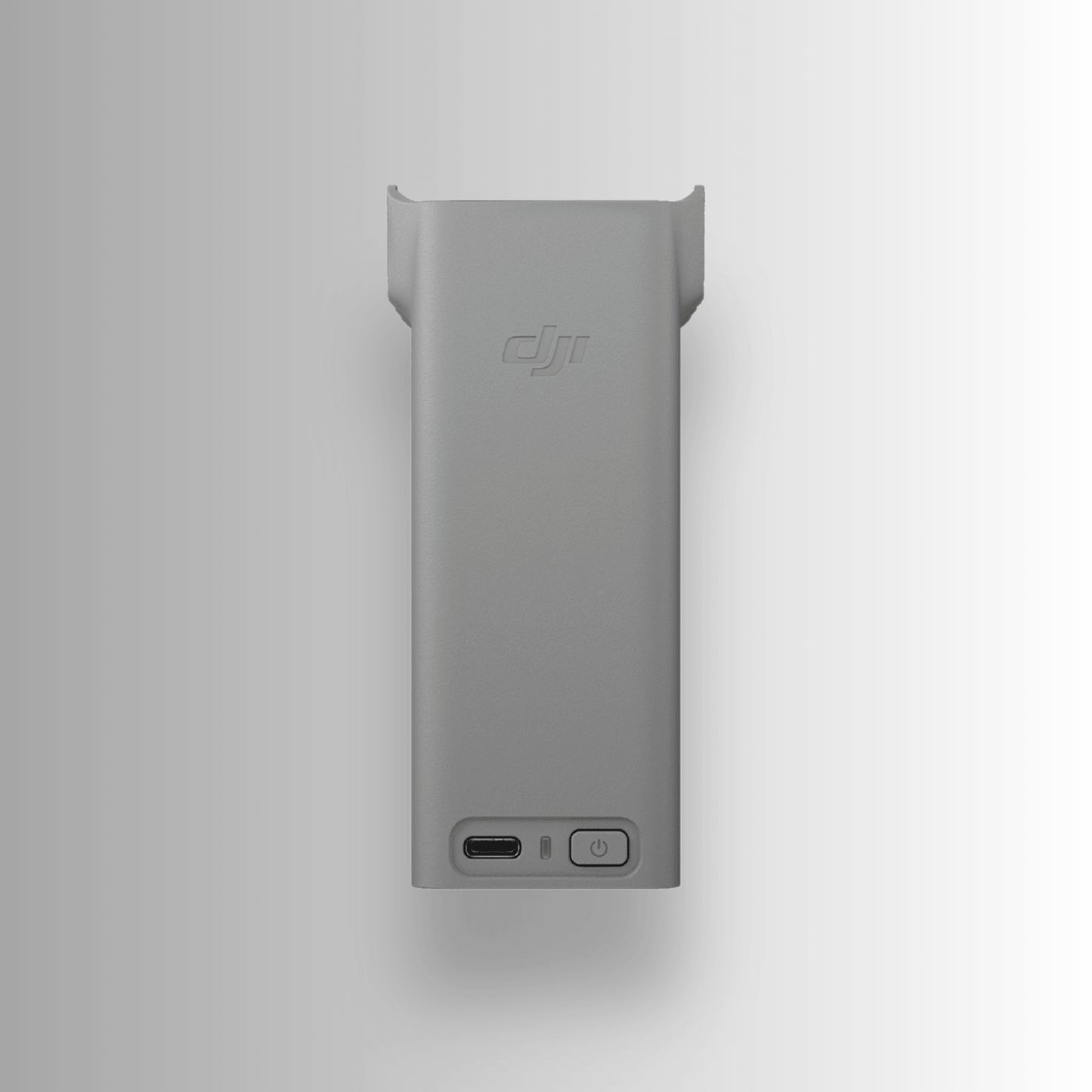 Side angle of a Grey two-way charging hub with multiple slots and a USB port for DJI Avata 360 on a white background