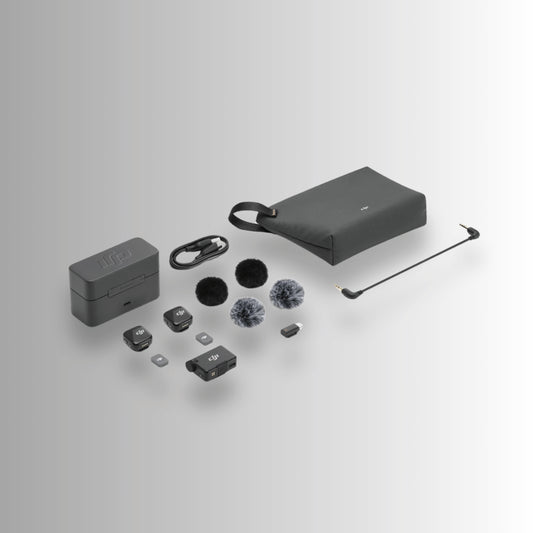 DJI Mic Mini complete kit including transmitters, receiver, windscreens, charging case, cables, and carrying pouch