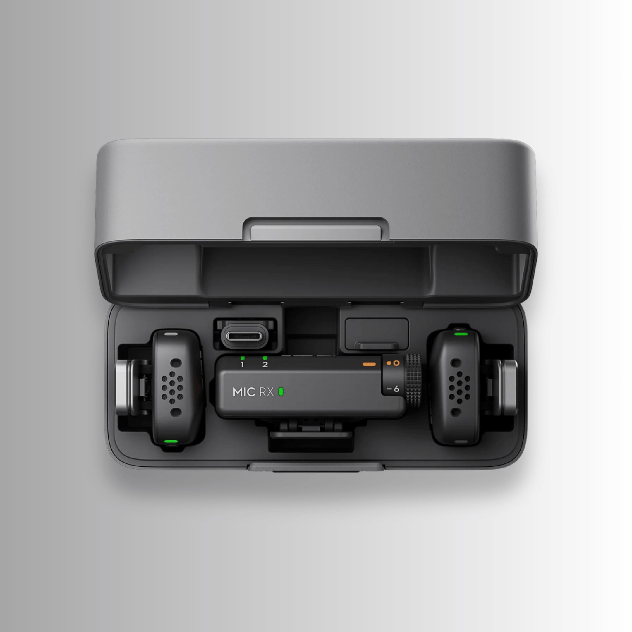 Top view of DJI Mic Mini 2 TX + 1 RX system in charging case with LED battery indicators