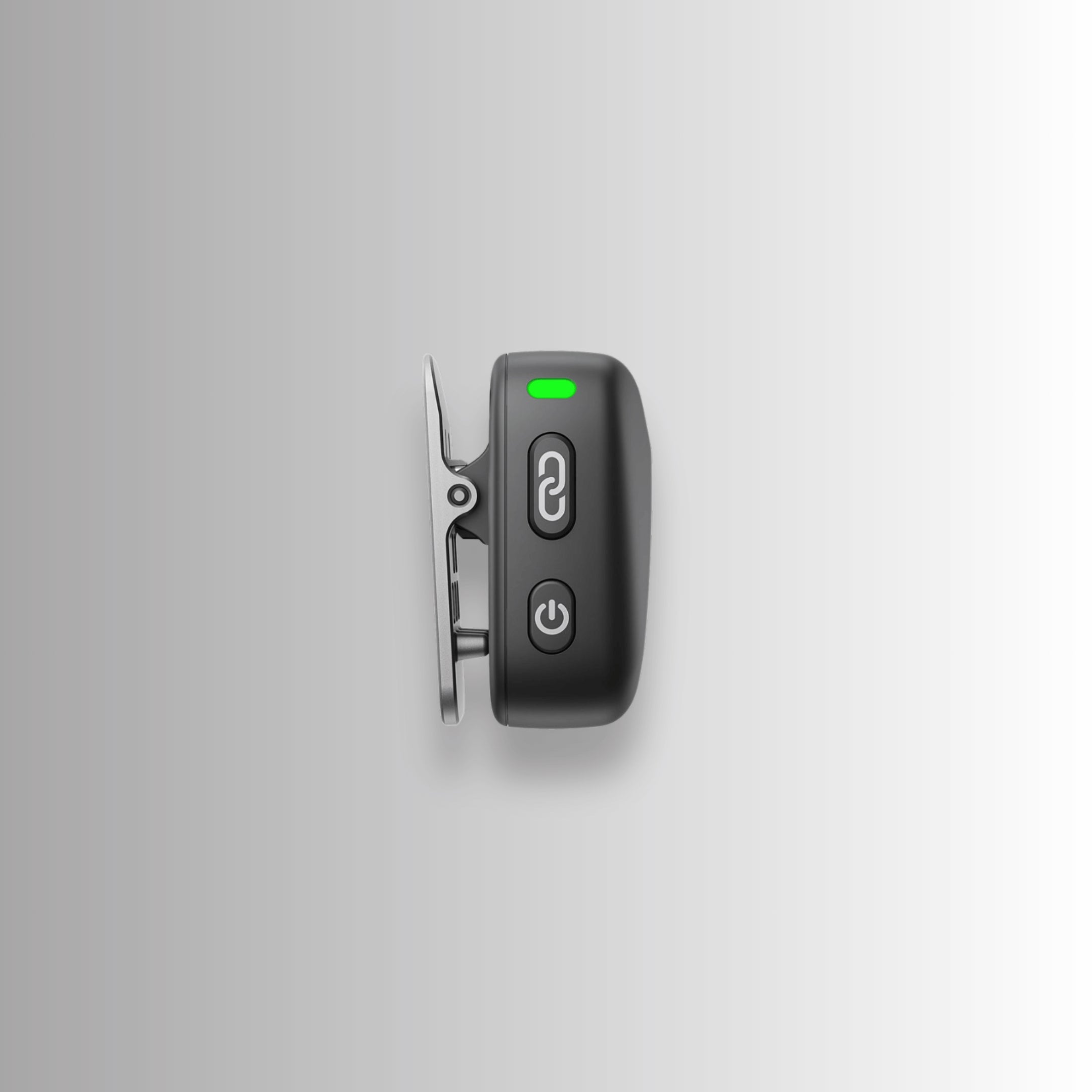 DJI Mic Mini clip and power buttons close-up — easy-attach wireless microphone system for content creators