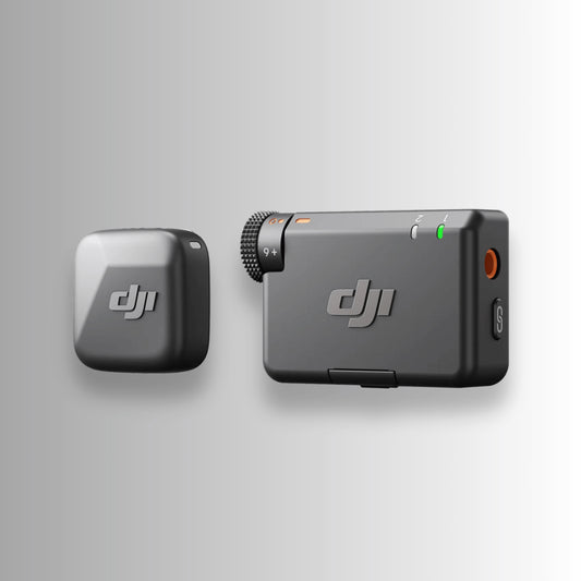 Close-up of DJI Mic Mini transmitter and receiver in matte black — compact wireless audio system for DJI Mini 5 Pro, Osmo Pocket 3, and Mavic drones.